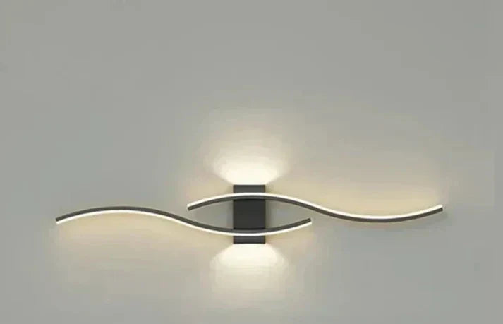 Curved LED Wall Sconce with Flowing Design – Warm White Light for Bedroom, Living Room, Hallway – Modern Metal Fixture | Lonoma